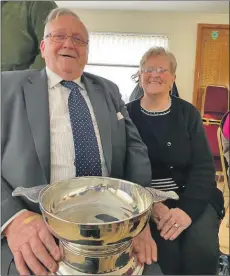  ??  ?? Donnie and Kate McKerral with the stalwart trophy.