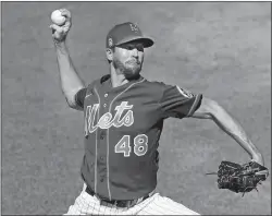  ?? KATHY WILLENS/AP PHOTO ?? In this July 9 file photo, New York Mets starting pitcher Jacob deGrom winds up while delivering during a simulated game at Citi Field in New York.