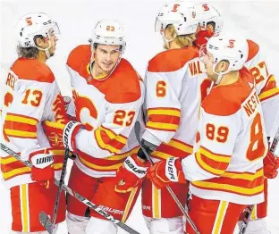  ?? POSTMEDIA NEWS ?? Calgary Flames Sean Monahan celebrates after scoring during a training camp intra-squad game at the Saddledome in Calgary on Jan. 7.