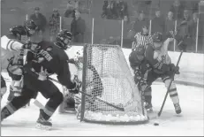  ?? Carole morris-underhill ?? The Avon View Avalanche and Horton High Griffins battled for control of the puck Dec. 9. The Valley team went on to win 4-3.