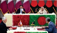  ?? AFP ?? Emir of Qatar Sheikh Tamim bin Hamad Al-Thani, left, and Bangladesh’s Prime Minister Sheikh Hasina attend the bilateral agreement signing ceremony in Dhaka on Tuesday.