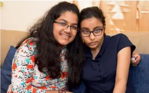  ??  ?? Haritha (L) and Namitha were given Year of Zayed Special Award by their school. — Supplied photo