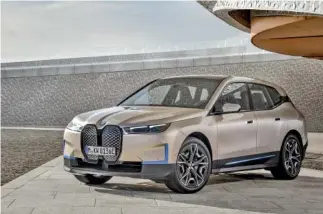  ?? BMW VIA AP ?? German luxury automaker BMW on Wednesday gave an early look at a new battery-powered iX.