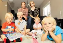  ?? Calgary Herald/files ?? Greg and Ainsley Tymchyna, with their children, Reid, 2, Avery, 6, Natalie, and Taylor, 4, are not happy their temporary home at the Great Plains housing camp for flood victims is closing soon. “I’m pretty mad, actually, Ainsley said.