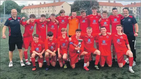  ??  ?? Oban Saints players and coaches Alex Craik and Allan MacDonald with the Divisional Cup.