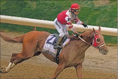  ?? Associated Press ?? Celebratin­g: Sonny Leon celebrates after riding Rich Strike to victory in the 148th running of the Kentucky Derby horse race at Churchill Downs earlier this month in Louisville, Ky.