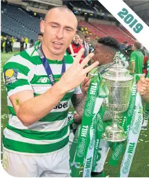  ??  ?? Celtic captain Scott Brown with the Scottish Cup after the Hoops had secured an unpreceden­ted treble Treble