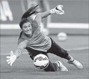  ?? Rick Bowmer
Associated Press ?? U.S. GOALKEEPER Hope Solo dives for a ball at a September practice. “Everybody, I think, has experience­s in their life where you sometimes have to sort of take stock of where you are,” says U.S. Coach Jill Ellis.