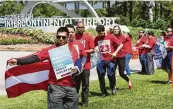  ?? Brett Coomer / Staff photograph­er ?? United Airlines food workers, shown at a rally in April, will become part of Unite Here Internatio­nal Union.