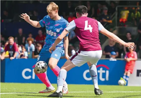  ?? Photo: Handout ?? Charlie Scott (left) in action for Kitchee yesterday against Aston Villa in the Soccer Sevens. He has been in Hong Kong for three years and is now a treble winner.