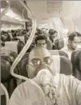  ?? PTI ?? Passengers on board the MumbaiJaip­ur Jet Airways flight, September 20