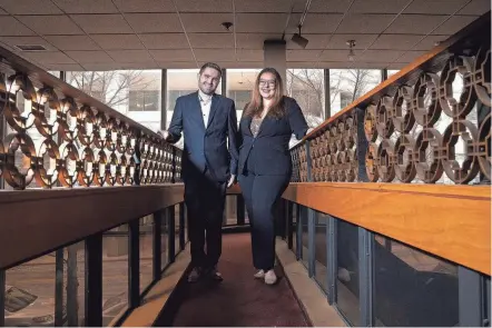  ?? BROOKE LAVALLEY/COLUMBUS DISPATCH ?? Austin Lucas-mattox and Tora Bonnier stand in a walkway near the dining room of the former Ho Toy restaurant location in Downtown Columbus. The two are partners in creating an LGBTQ+ dance club in part of the building, while Bonnier plans to turn other floors into two separate restaurant­s and coworking space.