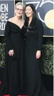  ?? VALERIE MACON/GETTY IMAGES ?? Meryl Streep walked the red carpet with Ai-jen Poo, head of the National Domestic Workers Alliance.