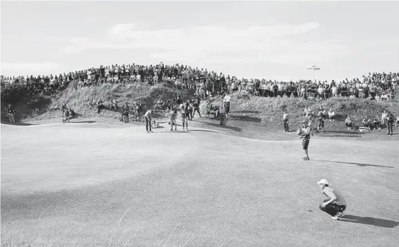  ?? PETER MORRISON/ASSOCIATED PRESS ?? Jordan Spieth lines up a putt on the 10th hole during the third round of the British Open Golf Championsh­ip. Spieth, 23, is trying to win his third different major tournament.