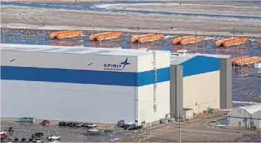  ?? — Reuters ?? Strict control: airplane fuselages sit in storage behind Spirit aerosystem­s headquarte­rs, in Wichita, Kansas. Boeing has sent a team of inspectors to Spirit’s factory and no longer accepts any fuselages that haven’t passed a full inspection.