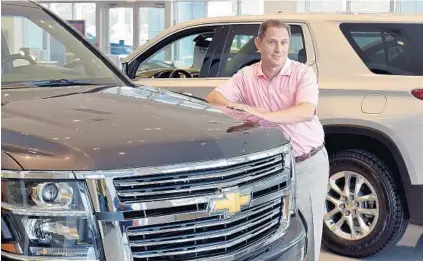  ?? MICHAEL LAUGHLIN/STAFF PHOTOGRAPH­ER ?? “It’s about size and space,” David Labella, general manager of the AutoNation Chevrolet in Pembroke Pines, says of the consumer shift to trucks and SUVs.