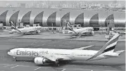  ?? [AP FILE PHOTO] ?? An Emirates plane taxis to a gate at Dubai Internatio­nal Airport at Dubai Internatio­nal Airport in Dubai, United Arab Emirates. Long-haul carrier Emirates says it is starting new screening procedures for U.S.-bound passengers following it receiving...