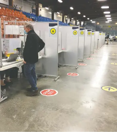  ?? EVANGELINE SADLER ?? There were no lineups Tuesday to get the AstraZenec­a vaccine at Bob Birnie Arena in Pointe-Claire, outside Montreal.