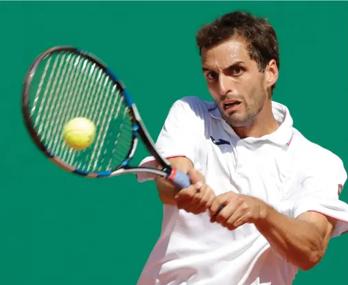  ??  ?? Albert Ramos-Vinolas plays a shot to Martin Cilic during the Monte Carlo Masters in Monaco on Friday. (Reuters)