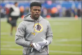  ?? The Associated Press ?? VIRUS CONCERNS: Then-Washington Redskins running back Chris Thompson (25) warms up before a Oct. 28, 2018, football game against the New York Giants in East Rutherford, N.J. Reporters from The Associated Press spoke to more than two dozen athletes from around the globe — representi­ng seven countries and 11 sports — to get a sense of how concerned or confident they are about resuming competitio­n.