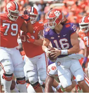  ?? JOSHUA S. KELLY/USA TODAY SPORTS ?? Clemson Tigers QB Trevor Lawrence (16) looks to pass during the first half of the spring game April 6 at Clemson Memorial Stadium.