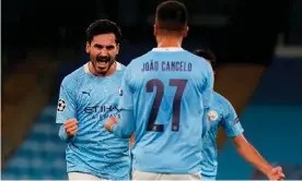  ?? Photograph: Tim Keeton/AFP/Getty Images ?? Ilkay Gündogan celebrates after his fine free-kick gave Manchester City the lead in the second half against Porto.