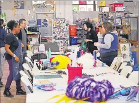  ?? [DOUG HOKE PHOTOS/THE OKLAHOMAN] ?? Factory Obscura artists and volunteers work on the new experience “Mix-Tape” at The Womb on March 9.