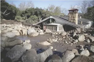  ??  ?? BURIED California. Debris from a mudslide covers a home on Wednesday ( Thursday in Manila) in Montecito,