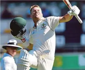  ?? AFP PIC ?? Australia’s batsman David Warner celebrates his century in the Test match against Pakistan in Brisbane yesterday.