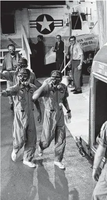  ?? NASA ?? The Apollo 12 crew arrives aboard the Hornet on Nov. 24, 1969.