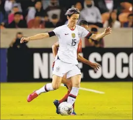  ?? Bob Levey Getty Images ?? MEGAN RAPINOE and the American women have no trouble getting past Costa Rica in Olympic qualifying and extending their unbeaten streak to 26 games.