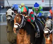  ?? CHELSEA DURAND/NYRA ?? Firenze Fire with jockey Jose Lezcano up and trained by Jason Servis held off a Happy Farm and T Loves a Fight to win Sunday’s Gravesend at Aqueduct Racetrack.