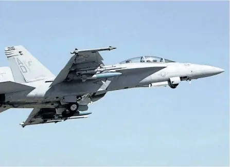  ?? THE CANADIAN PRESS FILES ?? A U. S. Air Force F-18 Super Hornet fighter aircraft takes off in India in 2011. The plane’s manufactur­er, Boeing, still hopes to sell 18 Super Hornets to Canada despite the company’s dispute with Bombardier. The Liberal government threatened last...