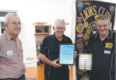 ?? Picture: Contribute­d ?? LION'S AWARD: Discussing the award are (from left) past district governor Lion David Orton, Toowoomba's Christmas Wonderland committee chair Lion Marshall Cox, club president Lion Merv Symons.