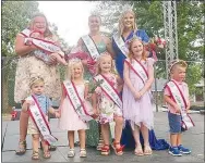  ?? Westside Eagle Observer/SUSAN HOLLAND ?? Winners of various age groups in the 2021 Gravette Day pageant Saturday, Aug. 14, pose for a group photo. Pictured are Mr. Tiny Tot Jaces Nunes (left, front), Little Miss Toddler Madison Gittlein, Little Miss Petite Clara Kate Edwards, Little Miss Kairi Rust, Little Mister Silas Duncan, Miss Preteen Grace Finley (left, rear) holding Pretty Baby Alicia Anne Surowiak, Miss Teen Gravette Shaelee Jensen and Miss Gravette Kaitlyn Loyd.