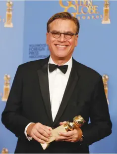  ?? (Reuters) ?? AARON SORKIN poses with the award for Best Screenplay - Motion Picture for ‘Steve Jobs’ last year.