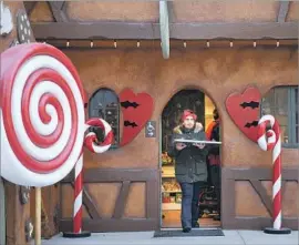  ?? Wally Skalij Los Angeles Times ?? MANY of the nearly 300 visitors Friday had fond memories of the original Santa’s Village, which closed in 1998. Above, the park’s Gingerbrea­d House bakery.