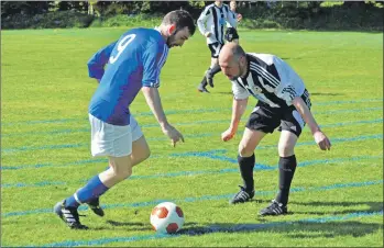  ?? 01_B20footy06 ?? Archie McNicol maintains possession as a defender blocks his way