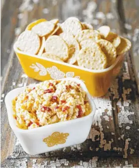  ??  ?? Pimento cheese gets a kick with bourbon in “The Southern Sympathy Cookbook.”