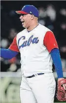  ?? GETTY IMAGES FILE PHOTO ?? Pitcher Miguel Lahera of Cuba celebrates his team’s victory after the World Baseball Classic Pool B Game 5 against Australia at the Tokyo Dome in March 2017.