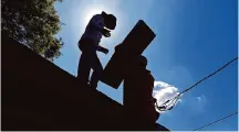  ?? James Durbin/Midland Reporter ?? When living in a place that is prone to ice, wind or hail, inspecting a roof for damaged or missing shingles can help prevent future leaks.