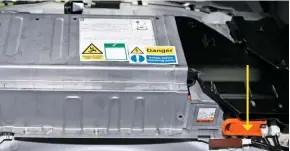  ??  ?? The high-voltage battery on this Prius is positioned beneath the rear seats and comprises not only the battery pack but also HV relays, fuses and a cooling system. Its temperatur­e and voltage is monitored by a battery control unit that can be built into the hybrid control unit’s ECU. The service connector, which you remove to isolate the battery from the vehicle, is arrowed.