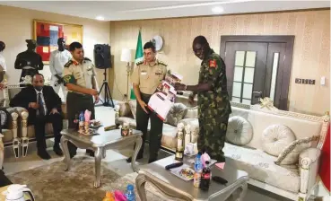  ?? PHOTO: ?? The Bangladesh Chief of Army Staff, General Abu Belal Muhammad Shafi’ul Huq receives a calendar from the Chief of Army Staff, Lieutenant -General TY Buratai (right), during his courtesy visit to Nigerian army chief at the Flag Staff House in Lagos...