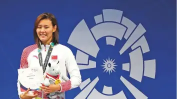  ?? AP ?? Women’s 50m backstroke gold medallist China’s Liu Xiang on the podium during the swimming competitio­n at the 18th Asian Games in Jakarta yesterday.