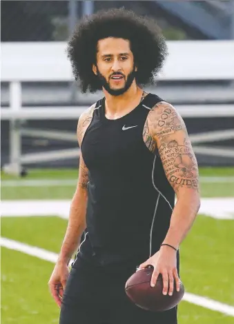  ?? ELIJAH NOUVELAGE/REUTERS ?? Former 49ers quarterbac­k Colin Kaepernick was criticized, and some allege blackballe­d, for kneeling during the U.S. national anthem before games as a protest against racial inequality.