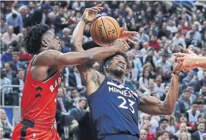  ?? STEVE RUSSELL TORONTO STAR ?? The Raptors’ OG Anunoby fouls Minnesota guard Jimmy Butler during Toronto’s victory at Scotiabank Arena on Wednesday night.