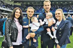  ??  ?? Album: the families of Trippier and Kane, above, and Butland and Young, right