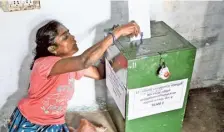  ?? ?? A differentl­yabled person casts her vote at her residence for the Erode constituen­cy on Thursday. M. GOVARTHAN