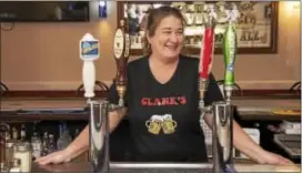  ?? RICK KAUFFMAN - DIGITAL FIRST MEDIA ?? Lisa Rouse of Ridley tends bar at the newly re-opened Clank’s in Marcus Hook.