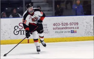  ?? NEWS PHOTO JAMES TUBB ?? Medicine Hat Tigers defenseman Josh Van Mulligen looks to make a breakout pass in the first period of the Tigers 4-0 loss at Co-op Place Tuesday against the Saskatoon Blades.